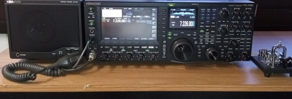 Kenwood TS-990S, speaker, microphone, and Vibroplex key on the operating desk
